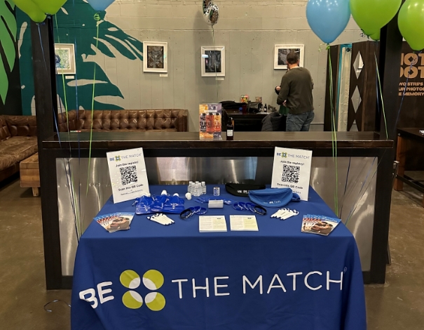 Taylor's fundraising and recruitment table at her 5-year transplant anniversary event