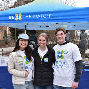 Three volunteers at a be the match donor registry drive